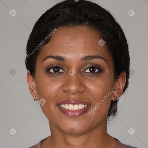 Joyful black young-adult female with medium  brown hair and brown eyes