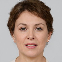 Joyful white adult female with short  brown hair and brown eyes