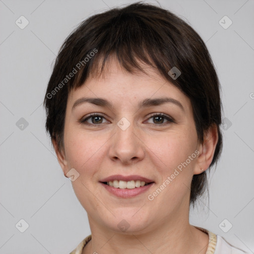 Joyful white young-adult female with medium  brown hair and brown eyes