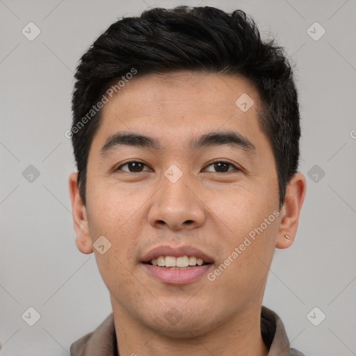 Joyful latino young-adult male with short  black hair and brown eyes