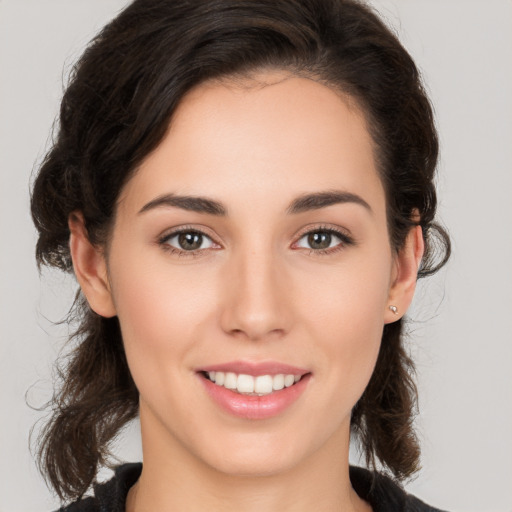 Joyful white young-adult female with medium  brown hair and brown eyes