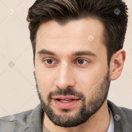 Neutral white young-adult male with short  brown hair and brown eyes