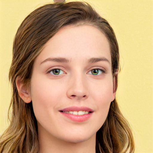 Joyful white young-adult female with long  brown hair and green eyes