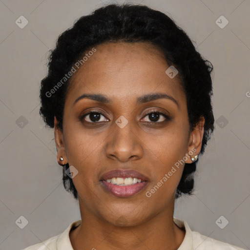 Joyful black young-adult female with short  black hair and brown eyes