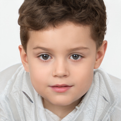 Joyful white child male with short  brown hair and brown eyes