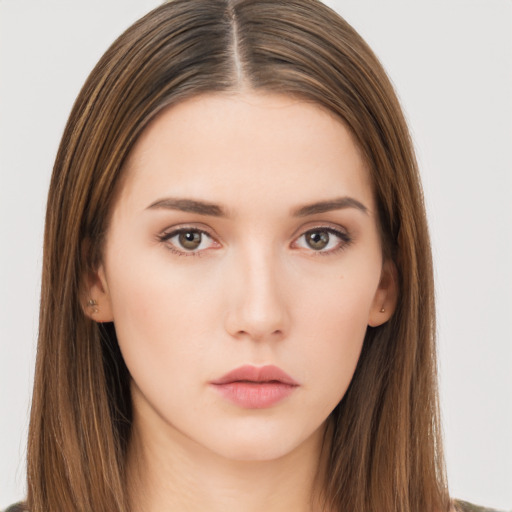 Neutral white young-adult female with long  brown hair and brown eyes