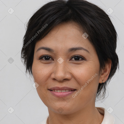 Joyful asian adult female with medium  brown hair and brown eyes