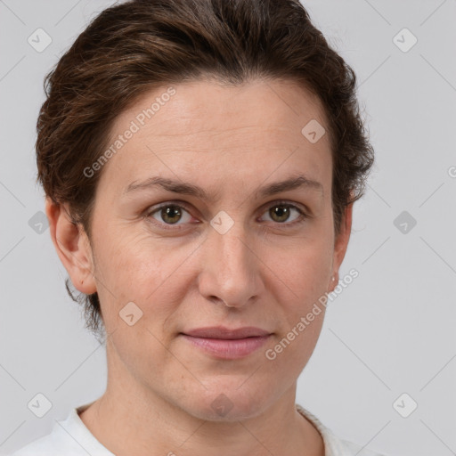 Joyful white adult female with short  brown hair and grey eyes