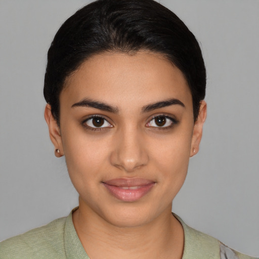 Joyful latino young-adult female with short  brown hair and brown eyes
