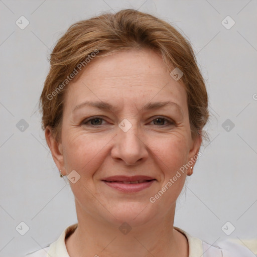 Joyful white adult female with short  brown hair and brown eyes