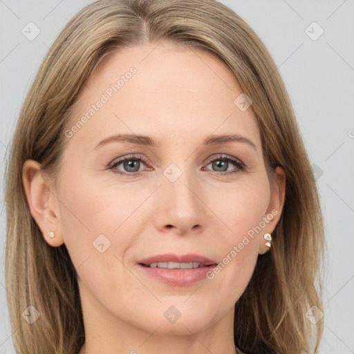 Joyful white adult female with long  brown hair and grey eyes