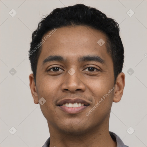 Joyful latino young-adult male with short  black hair and brown eyes