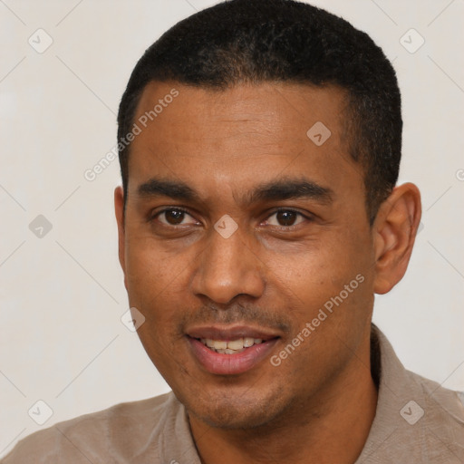 Joyful black young-adult male with short  black hair and brown eyes