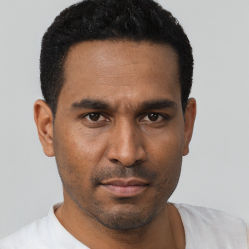 Neutral black young-adult male with short  black hair and brown eyes