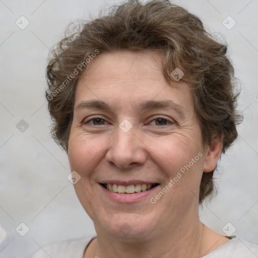 Joyful white adult female with short  brown hair and brown eyes