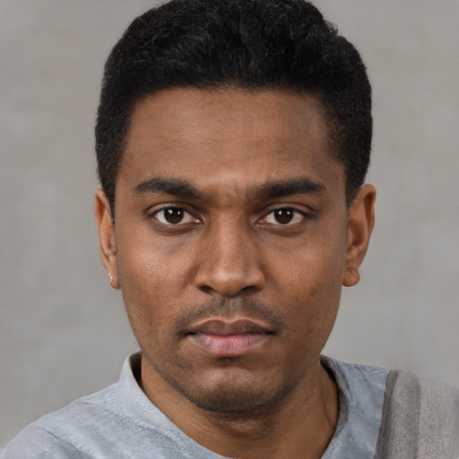Neutral black young-adult male with short  black hair and brown eyes