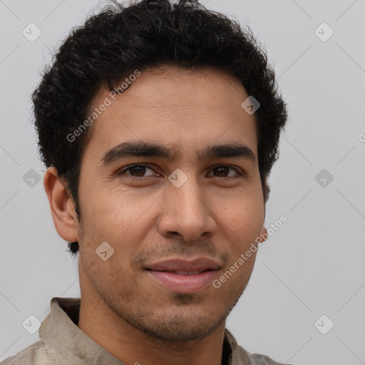 Joyful latino young-adult male with short  brown hair and brown eyes