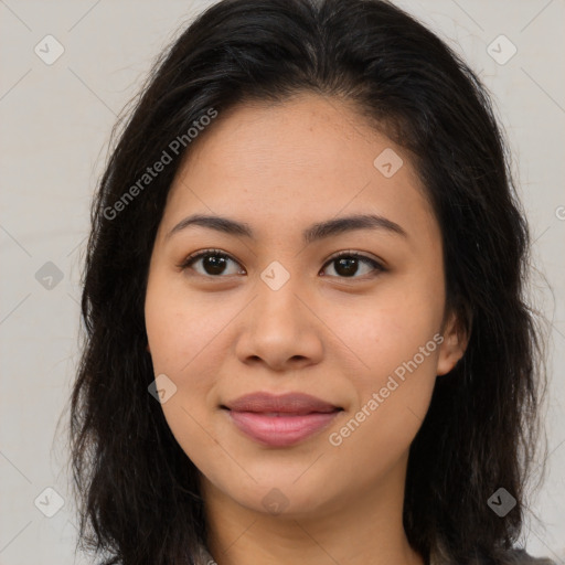 Joyful asian young-adult female with long  brown hair and brown eyes