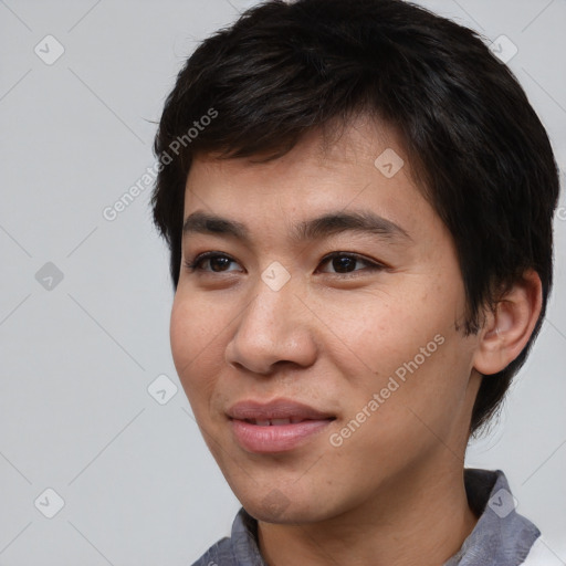 Joyful asian young-adult male with short  black hair and brown eyes