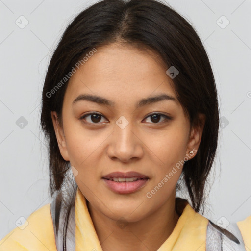 Joyful latino young-adult female with medium  brown hair and brown eyes