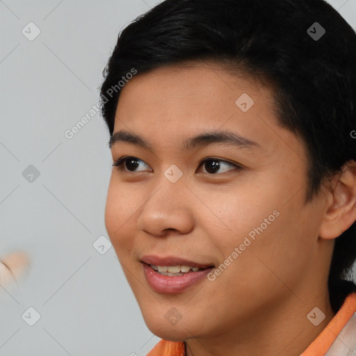 Joyful asian young-adult female with short  black hair and brown eyes