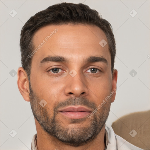 Neutral white young-adult male with short  brown hair and brown eyes