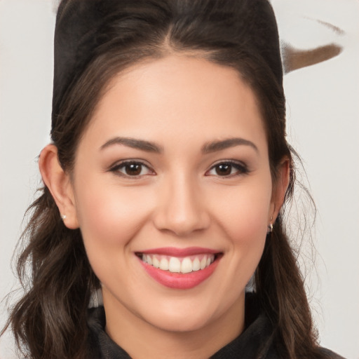 Joyful white young-adult female with long  brown hair and brown eyes