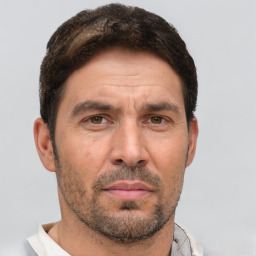 Neutral white adult male with short  brown hair and brown eyes