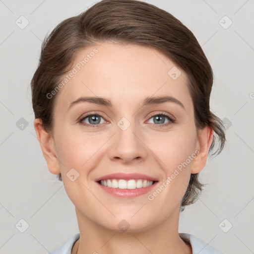 Joyful white young-adult female with short  brown hair and grey eyes