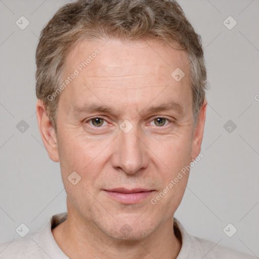 Joyful white adult male with short  brown hair and grey eyes