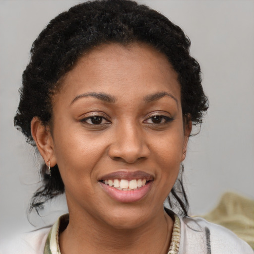 Joyful latino young-adult female with short  brown hair and brown eyes