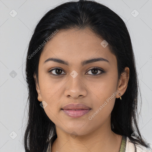 Joyful latino young-adult female with long  brown hair and brown eyes