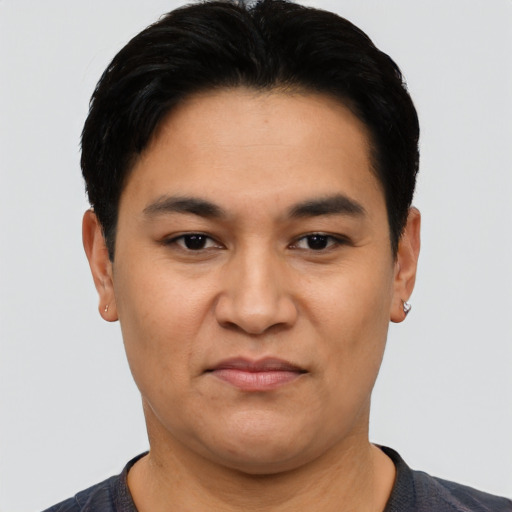Joyful asian young-adult male with short  black hair and brown eyes