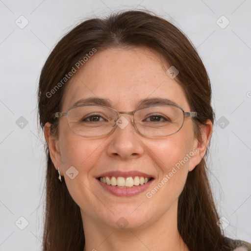 Joyful white adult female with long  brown hair and grey eyes