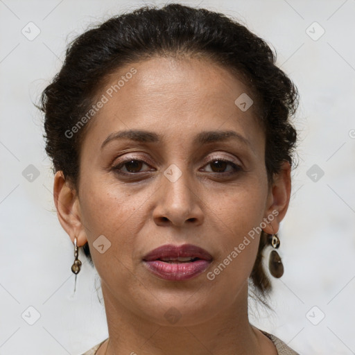 Joyful white adult female with short  brown hair and brown eyes