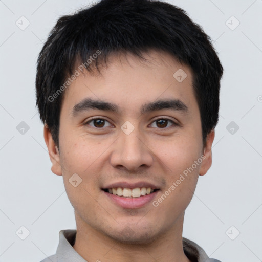 Joyful white young-adult male with short  black hair and brown eyes