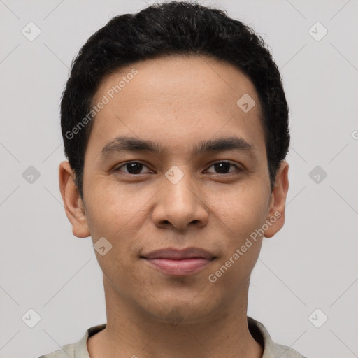 Joyful latino young-adult male with short  black hair and brown eyes