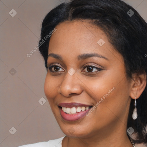 Joyful black young-adult female with medium  black hair and brown eyes