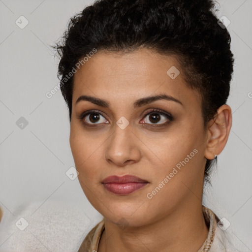 Joyful latino young-adult female with short  brown hair and brown eyes