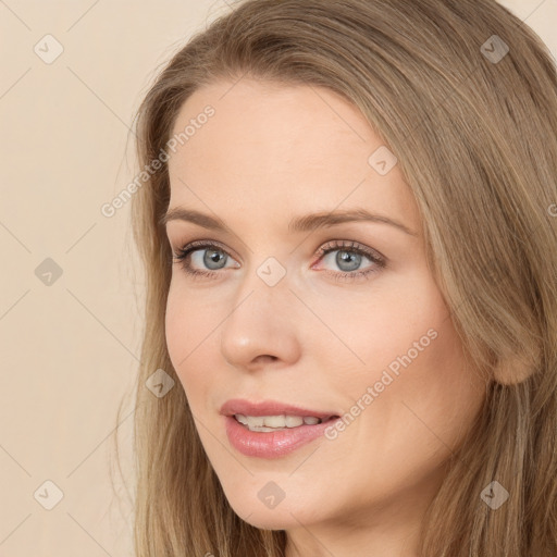 Joyful white young-adult female with long  brown hair and green eyes