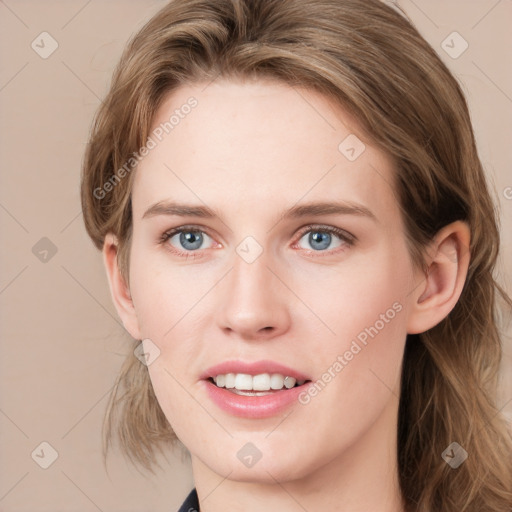 Joyful white young-adult female with medium  brown hair and blue eyes