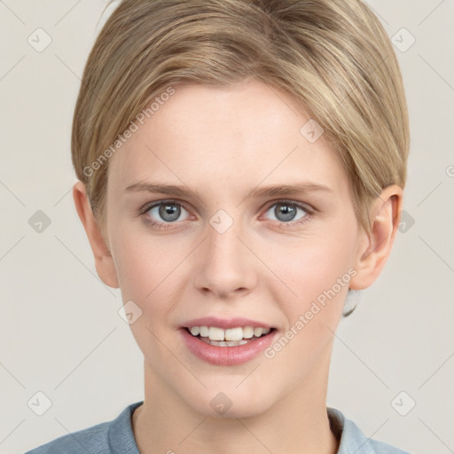 Joyful white young-adult female with short  brown hair and grey eyes