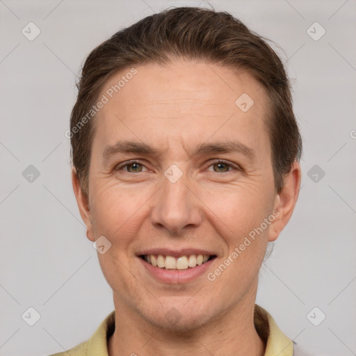 Joyful white adult male with short  brown hair and brown eyes