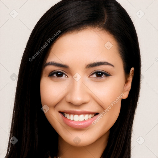 Joyful latino young-adult female with long  brown hair and brown eyes