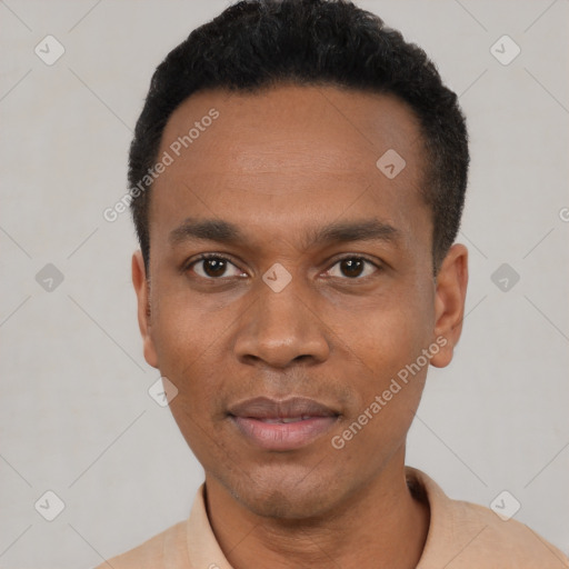 Joyful black young-adult male with short  black hair and brown eyes