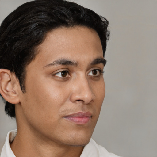 Neutral latino young-adult male with short  brown hair and brown eyes