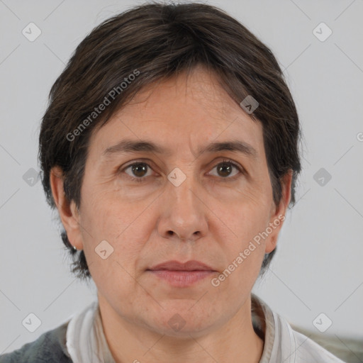 Joyful white adult female with short  brown hair and brown eyes