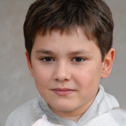 Joyful white child male with short  brown hair and brown eyes