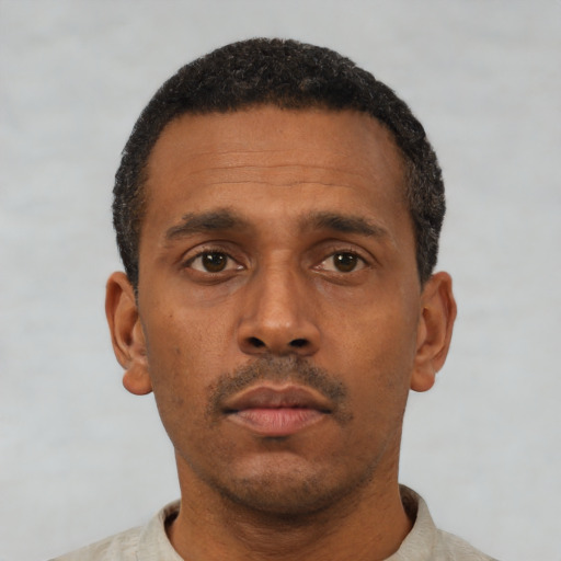 Neutral black adult male with short  black hair and brown eyes