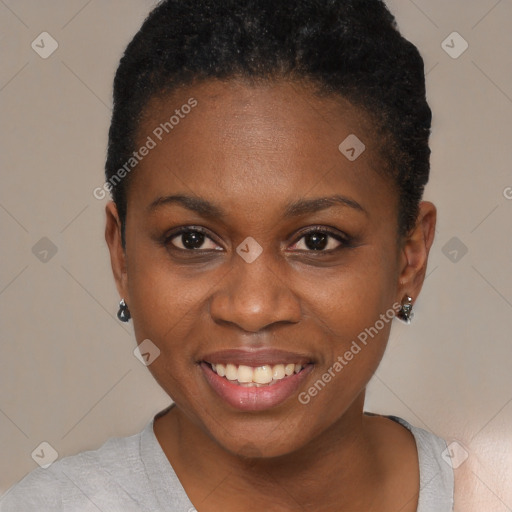 Joyful black young-adult female with short  brown hair and brown eyes